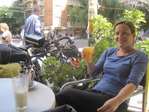 Relaxing with a milkshake and orange juice, whilst waiting for our warm showers host in Buenos Aires: Virginia