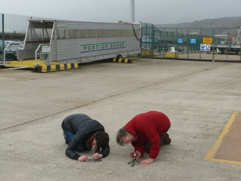 Two members of the Hannis family bow down in reverence to the returning cyclists...